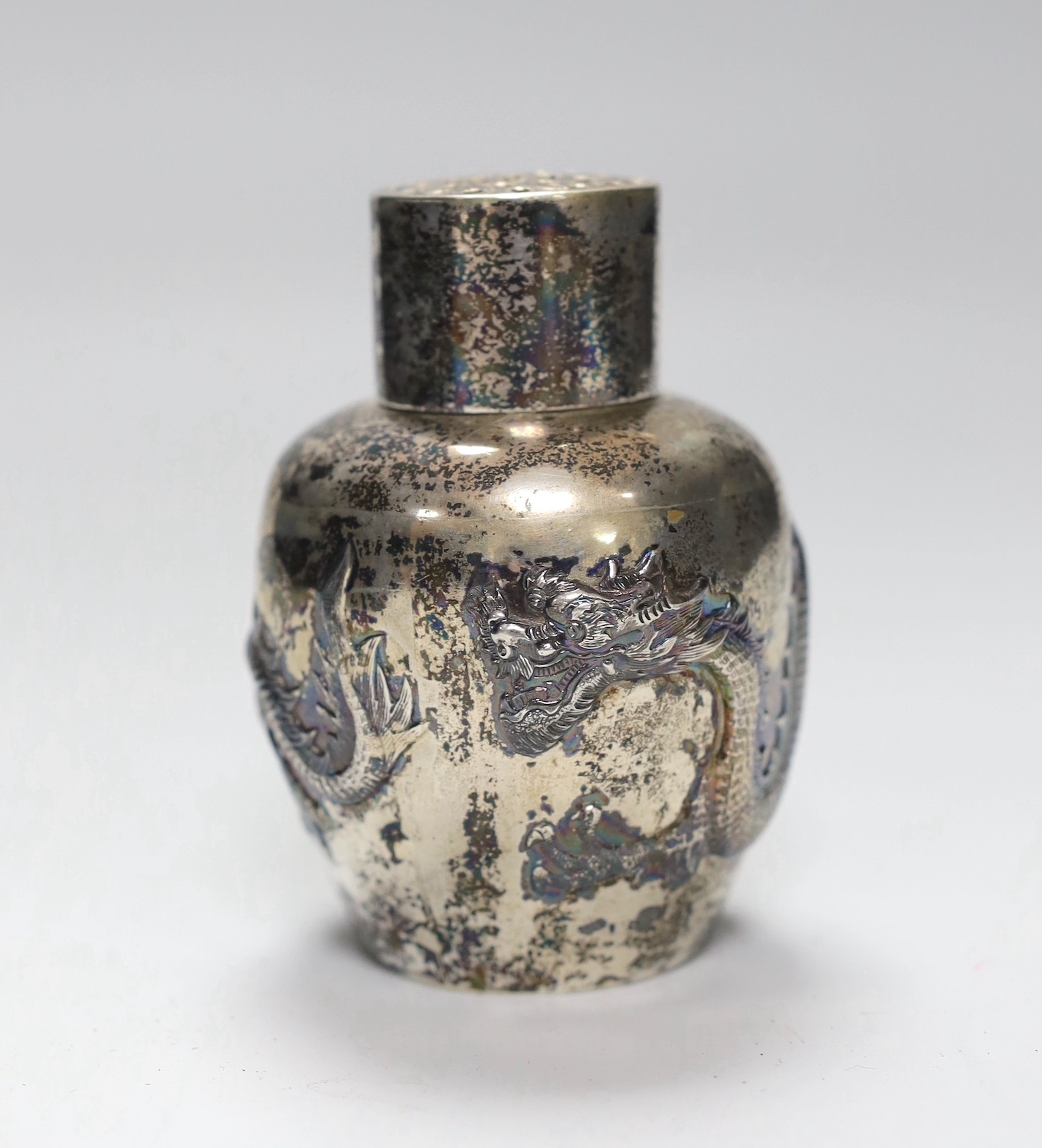 A late 19th/early 20th century Chinese Export white metal sugar sifter, by Wang Hing, Hong Kong, decorated with a dragon, height 10.2cm, 5.2oz.